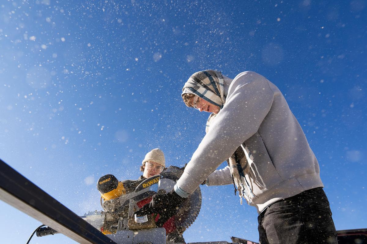 Francis Black '26 works at a WSO Priddy Experience community service for a Habitat for Humanity work site in Woodland Park in the Rocky Mountain Southwest on 1/26/23. Photo by Lonnie Timmons III / Colorado College